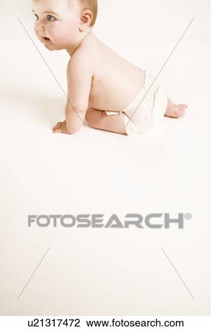 Studio shot of baby (1-6 months) crawling View Large Photo Image Stock Image - Studio shot of baby (1-6 months) crawling. Fotosearch