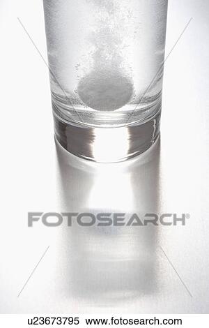Tablet dissolving in glass of water View Large Photo Image Stock Photography - Tablet dissolving in glass of water. Fotosearch