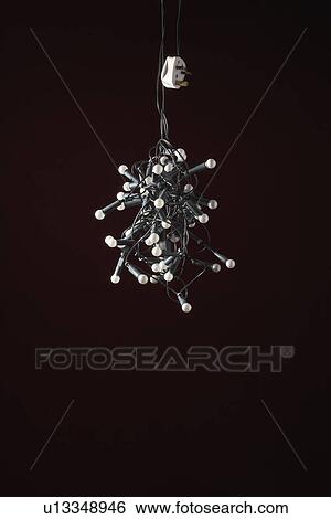 Stock Photograph - Tangled lights on black background. Fotosearch