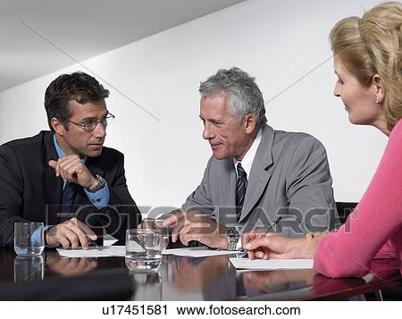 Three business colleagues in conference meeting View Large Photo Image Stock Image - Three business colleagues in conference meeting. Fotosearch