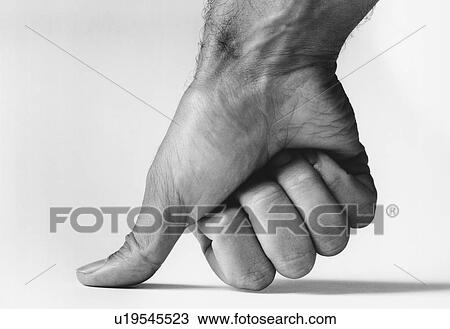 Stock Image - Thumb pressing down (b&w) (close-up). Fotosearch