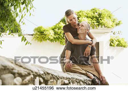 Tourist Couple on Stone Wall in Granada Spain front view View Large Photo Image Stock Photograph - Tourist Couple on Stone Wall in Granada Spain front view. Fotosearch