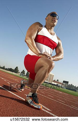 Stock Image - Track Athlete Warming Up. Fotosearch