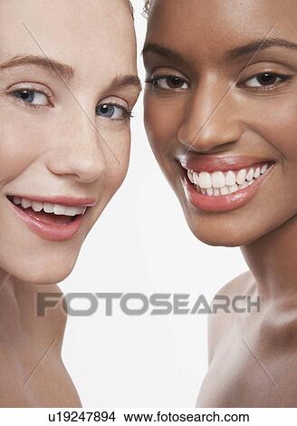 Picture - Two beautiful young women smiling. Fotosearch