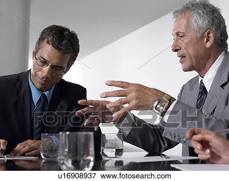 Two businessmen in conference meeting View Large Photo Image Stock Photo - Two businessmen in conference meeting. Fotosearch