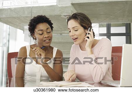 Two Businesswomen in Meeting View Large Photo Image Stock Image - Two Businesswomen in Meeting. Fotosearch