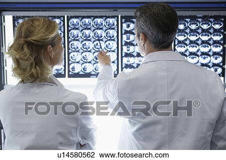 Two Doctors Examining X-rays View Large Photo Image Stock Image - Two Doctors Examining X-rays. Fotosearch