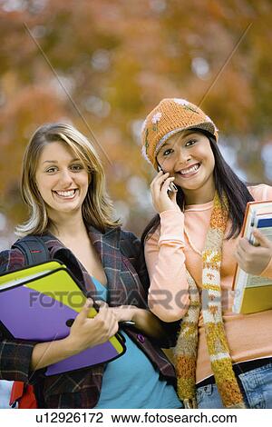 Two female students outdoors (portrait) View Large Photo Image Stock Image - Two female students outdoors (portrait). Fotosearch
