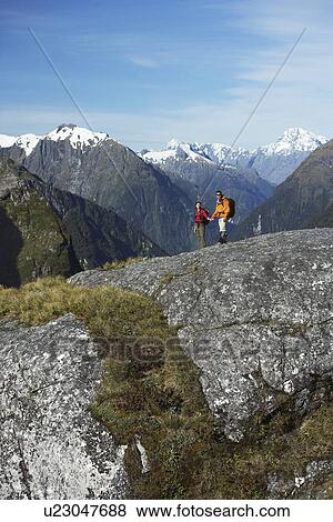 Two hikers in mountains View Large Photo Image Stock Photo - Two hikers in mountains. Fotosearch