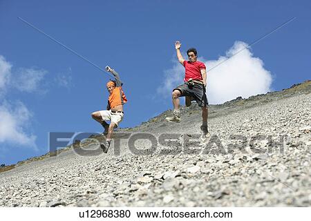 Two men jumping down screen field View Large Photo Image Stock Image - Two men jumping down screen field. Fotosearch
