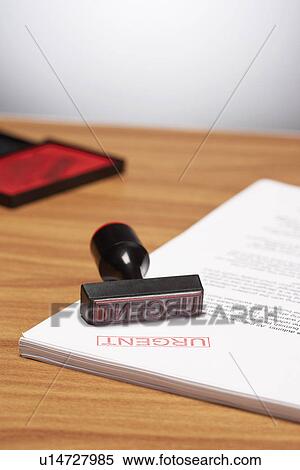 Urgent Stamp on Paperwork View Large Photo Image Stock Photography - Urgent Stamp on Paperwork. Fotosearch