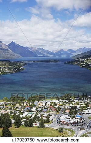 Village on the shore of mountain lake View Large Photo Image Stock Image - Village on the shore of mountain lake. Fotosearch