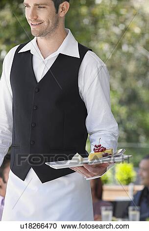 Waiter carrying slice of pie at outdoor cafe View Large Photo Image Stock Image - Waiter carrying slice of pie at outdoor cafe. Fotosearch