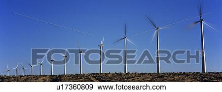 Wind turbines against blue sky View Large Photo Image Stock Photo - Wind turbines against blue sky. Fotosearch