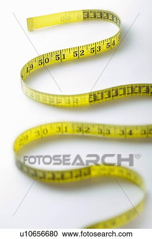 Winding strip of measuring tape close-up View Large Photo Image Stock Image - Winding strip of measuring tape close-up. Fotosearch