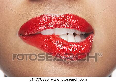 Woman biting lip View Large Photo Image Stock Image - Woman biting lip. Fotosearch
