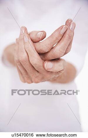 Stock Photograph - Woman Cupping Her Hands mid section. Fotosearch