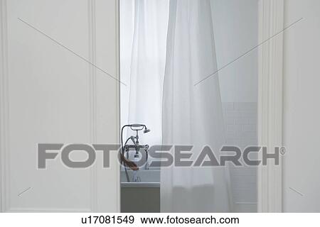 Stock Photo - Woman filling bathtub. Fotosearch