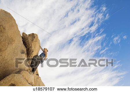 Woman Free Climbing on Rocks View Large Photo Image Stock Photo - Woman Free Climbing on Rocks. Fotosearch