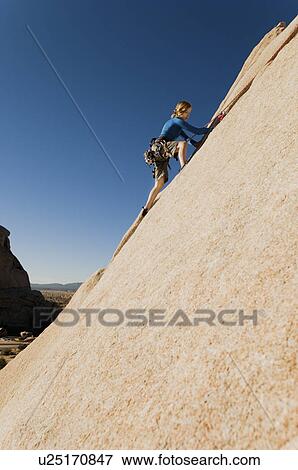 Woman Free Climbing up Cliff View Large Photo Image Stock Photo - Woman Free Climbing up Cliff. Fotosearch