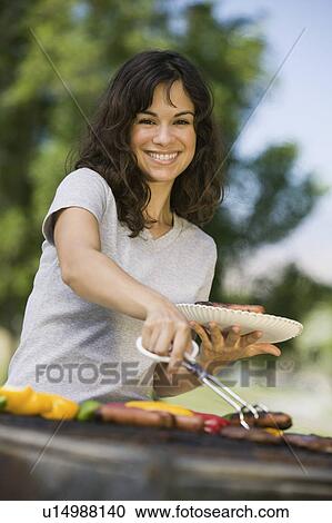 Woman Grilling Food at Park portrait. View Large Photo Image Stock Image - Woman Grilling Food at Park portrait.. Fotosearch