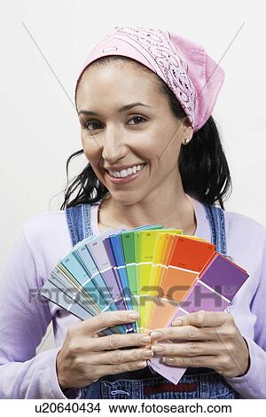 Woman holding paint colour samples portrait View Large Photo Image Picture - Woman holding paint colour samples portrait. Fotosearch