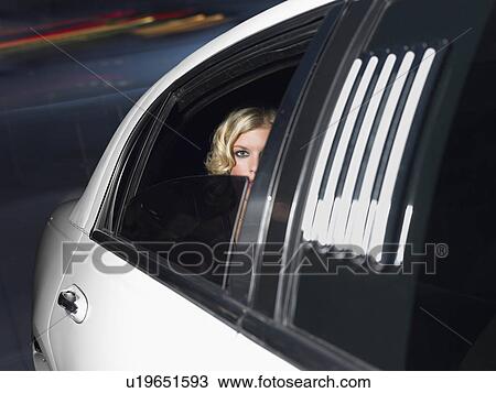 Woman in back of limousine View Large Photo Image Stock Image - Woman in back of limousine. Fotosearch