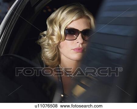 Woman in back of limousine View Large Photo Image Stock Photo - Woman in back of limousine. Fotosearch