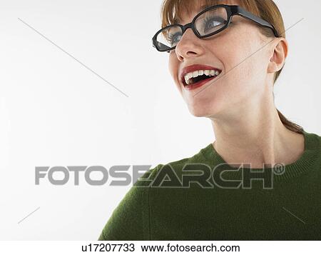 Woman in studio wearing glasses head and shoulders View Large Photo Image Stock Image - Woman in studio wearing glasses head and shoulders. Fotosearch