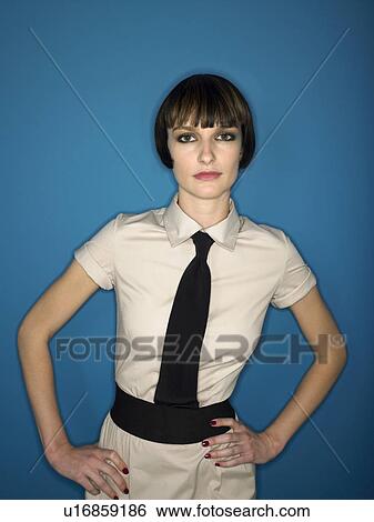 Woman in studio with hands on hips View Large Photo Image Stock Photograph - Woman in studio with hands on hips. Fotosearch