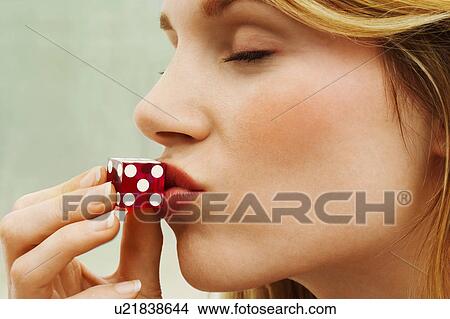 Woman Kissing Dice close up side view View Large Photo Image Picture - Woman Kissing Dice close up side view. Fotosearch