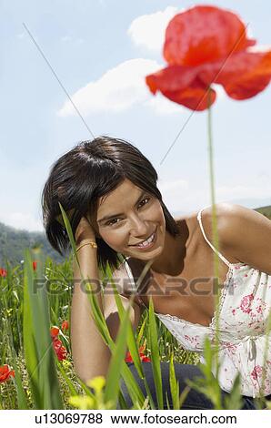 Woman Lying in flowery Meadow portrait View Large Photo Image Stock Photo - Woman Lying in flowery Meadow portrait. Fotosearch