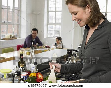 Woman preparing salad in kitchen View Large Photo Image Stock Photo - Woman preparing salad in kitchen. Fotosearch