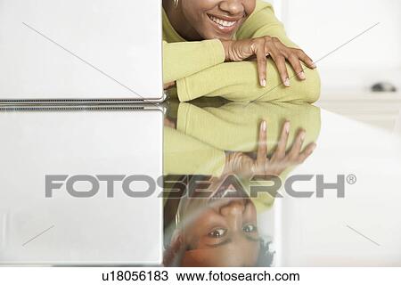 Woman resting on table portrait View Large Photo Image Stock Image - Woman resting on table portrait. Fotosearch