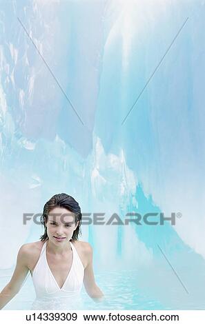 Woman standing in pool of water in ice crevice portrait View Large Photo Image Stock Photo - Woman standing in pool of water in ice crevice portrait. Fotosearch