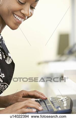 Woman using computer in office View Large Photo Image Picture - Woman using computer in office. Fotosearch