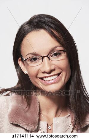 Picture - Woman wearing glasses portrait head and shoulders. Fotosearch
