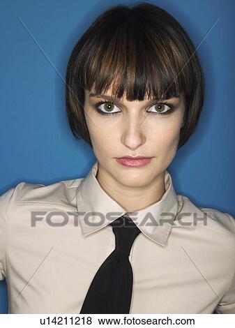 Woman wearing tie head and shoulders in studio View Large Photo Image Stock Photo - Woman wearing tie head and shoulders in studio. Fotosearch