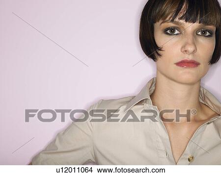 Picture - Woman with bangs in studio head and shoulders. Fotosearch