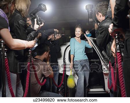 Woman with cleaning equipment getting out of limousine in front of paparazzi View Large Photo Image Stock Image - Woman with cleaning equipment getting out of limousine in front of paparazzi. Fotosearch