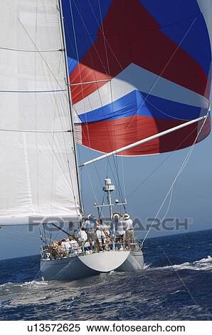 Yacht on ocean with full sail back view View Large Photo Image Stock Photography - Yacht on ocean with full sail back view. Fotosearch