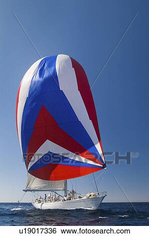 Stock Photograph - Yacht on ocean with full sail. Fotosearch