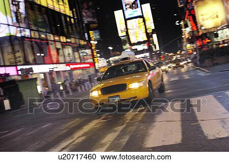 Yellow Taxi on City Street at Night View Large Photo Image Stock Image - Yellow Taxi on City Street at Night. Fotosearch
