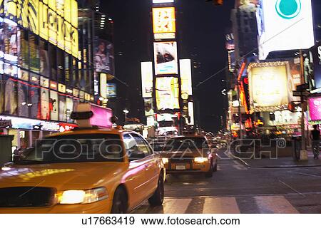 Yellow Taxis on City Street at Night View Large Photo Image Stock Photo - Yellow Taxis on City Street at Night. Fotosearch