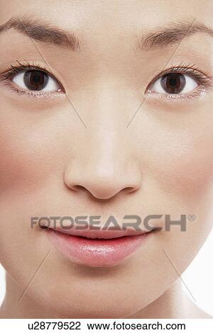 Stock Image - Young Asian woman smiling. Fotosearch
