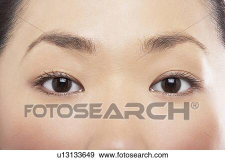 Young Asian woman's eyes View Large Photo Image Stock Photo - Young Asian woman's eyes. Fotosearch