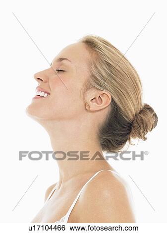Stock Photograph - Young Blonde Woman Laughing side view. Fotosearch