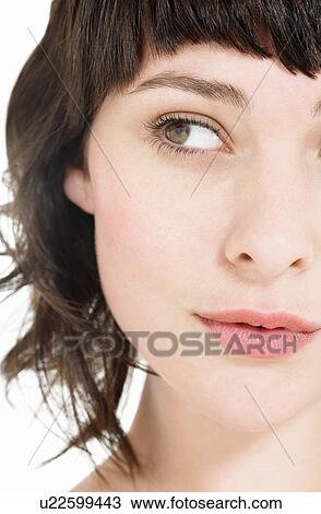Stock Image - Young Brunette Woman close up head shot. Fotosearch