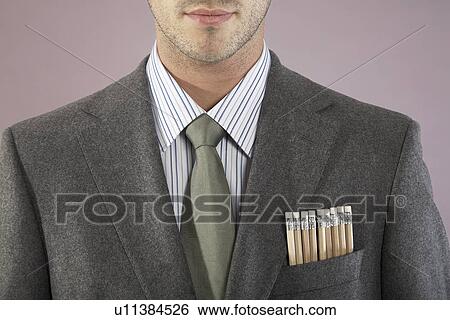 Stock Photograph - Young businessman with pencils in pocket close-up portrait. Fotosearch
