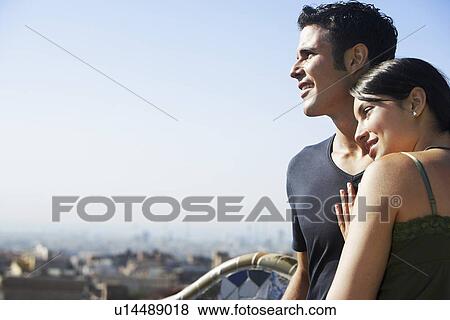 Stock Photo - Young couple enjoying view portrait. Fotosearch